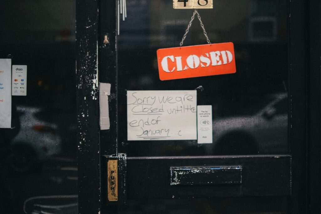 Closed sign hanging on a shop door