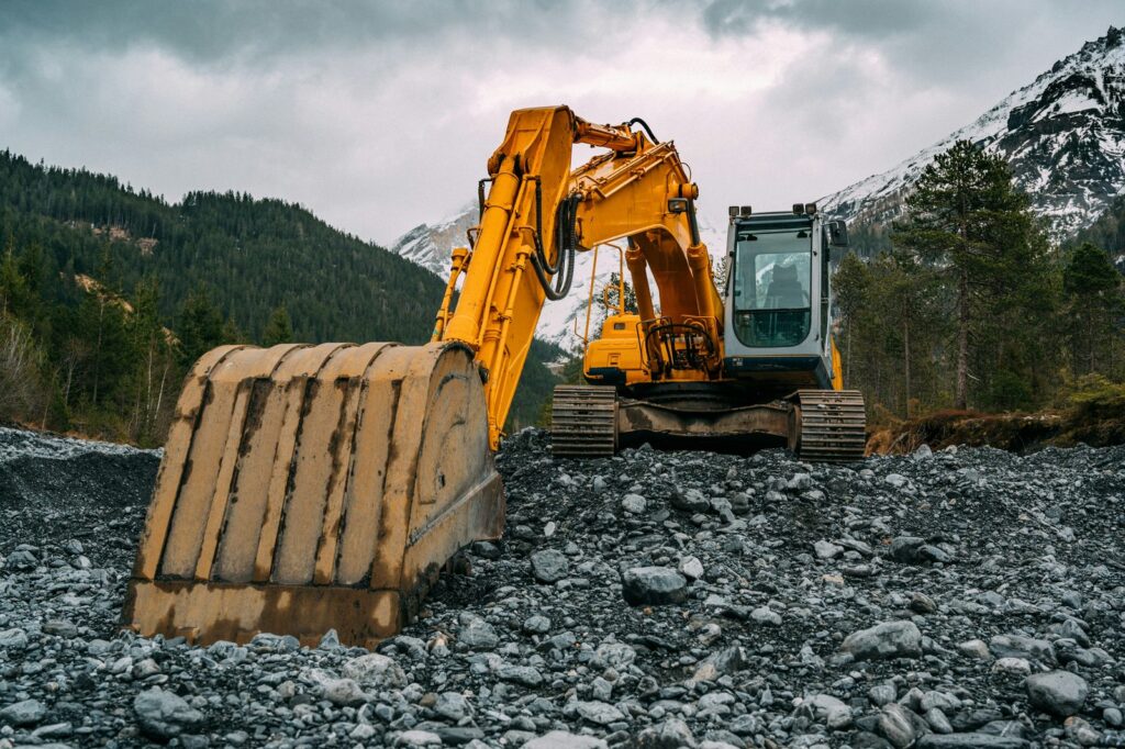 Excavator working on a rocky site