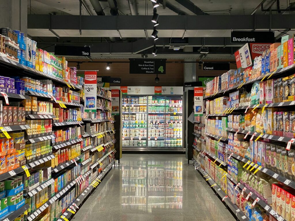 Stocked shelves in a supermarket aisle
